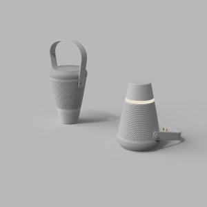 The image appears to be a 3d rendering but it could be a photograph. Two conical objects are depicted with a curved handle-like feature. On the left, one object is standing on the small side of the cone, its handle is turned up. On the right, the other object stands on the thicker part, with the handle turned behind it, resting on the floor. There is a net or speaker-like material that makes up the bulk of the body of the objects. The object on the right also appears to have a glowing band.
